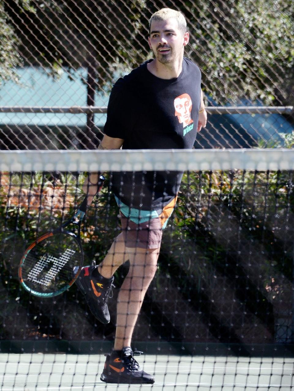 <p>Joe Jonas serves up <a href="https://people.com/parents/sophie-turner-joe-jonas-welcome-first-child/" rel="nofollow noopener" target="_blank" data-ylk="slk:new dad;elm:context_link;itc:0;sec:content-canvas" class="link ">new dad</a> vibes as he plays tennis in L.A. on Tuesday. </p>