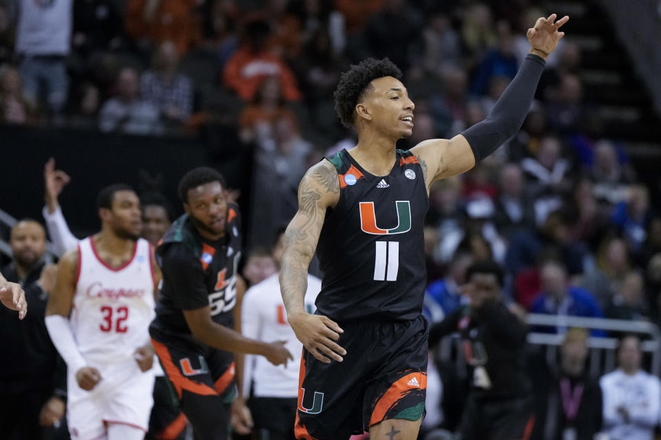 Miami guard Jordan Miller celebrates after scoring against Houston in the second half of a Sweet 16 college basketball game in the Midwest Regional of the NCAA Tournament Friday, March 24, 2023, in Kansas City, Mo. (AP Photo/Jeff Roberson)