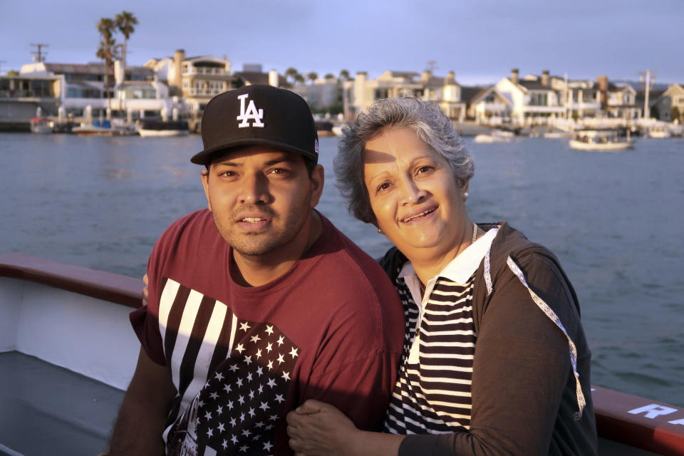 FILE - This undated file photo provided by Louana D'Cunha shows Kenneth French and his mother, Paola French. A grand jury has declined to bring charges against an off-duty Los Angeles police officer who fatally shot Kenneth French during an altercation in a Southern California Costco warehouse. Riverside County District Attorney Mike Hestrin announced the grand jury's decision Wednesday, Sept. 25, 2019. (Louana D'Cunha via AP, File)