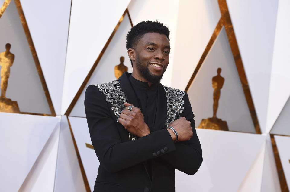 FILE - In this March 4, 2018 file photo, Chadwick Boseman arrives at the Oscars at the Dolby Theatre in Los Angeles. Actor Chadwick Boseman, who played Black icons Jackie Robinson and James Brown before finding fame as the regal Black Panther in the Marvel cinematic universe, has died of cancer. His representative says Boseman died Friday, Aug. 28, 2020 in Los Angeles after a four-year battle with colon cancer. He was 43. (Photo by Jordan Strauss/Invision/AP)