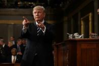 US President Donald Trump points to the audience after addressing a joint session of Congress in Washington, DC, on February 28, 2017