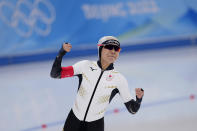 Miho Takagi of Japan reacts after her heat against Vanessa Herzog of Austria in the speedskating women's 500-meter race at the 2022 Winter Olympics, Sunday, Feb. 13, 2022, in Beijing. (AP Photo/Sue Ogrocki)