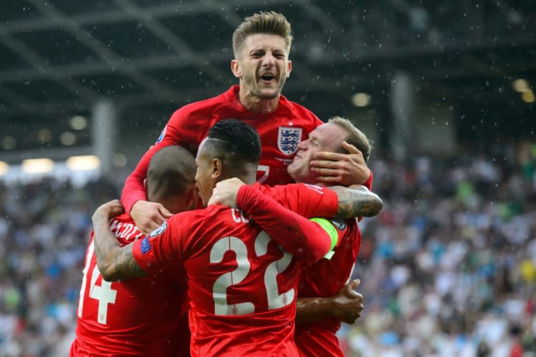 England's players celebrate after scoring during the Euro 2016 qualifying match against Slovenia in Ljubljana, on June 14, 2015