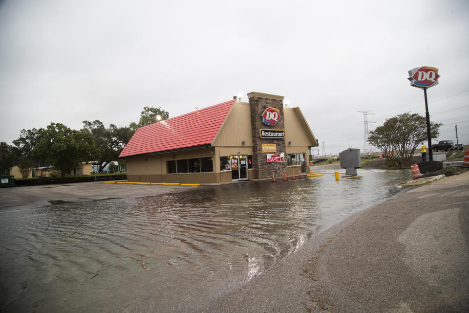 DQ Restaurant's parking area experiencing flooding ahead of Tropical Storm Beta Monday, Sept. 21, 2020 in Kemah, Texas. (Marie D. De Jesús/Houston Chronicle via AP)