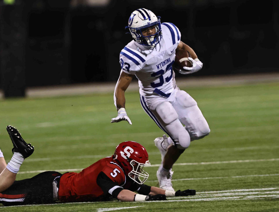 Wyoming running back C.J. Hester runs the ball during the Cowboys' Division IV OHSAA state semifinal against Steubenville Saturday, Nov 26, 2022.