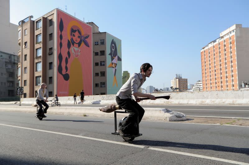 Vinicius Sanctus and Alessandro Russo ride electric monowheels called 'nuvem' (cloud) that were invented by them and inspired by the magic flying brooms of the Harry Potter series in Sao Paulo