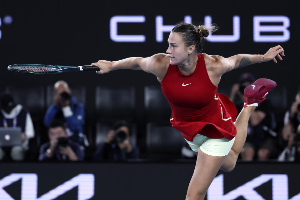 Aryna Sabalenka of Belarus plays a backhand return to Coco Gauff of the U.S. during their semifinal match at the Australian Open tennis championships at Melbourne Park, Melbourne, Australia, Thursday, Jan. 25, 2024. (AP Photo/Asanka Brendon Ratnayake)