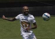 Brazilian Dani Alves smiles during his presentation as a new member of the Pumas UNAM soccer club, on the pitch at the Pumas training facility in Mexico City, Saturday, July 23, 2022. (AP Photo/Marco Ugarte)