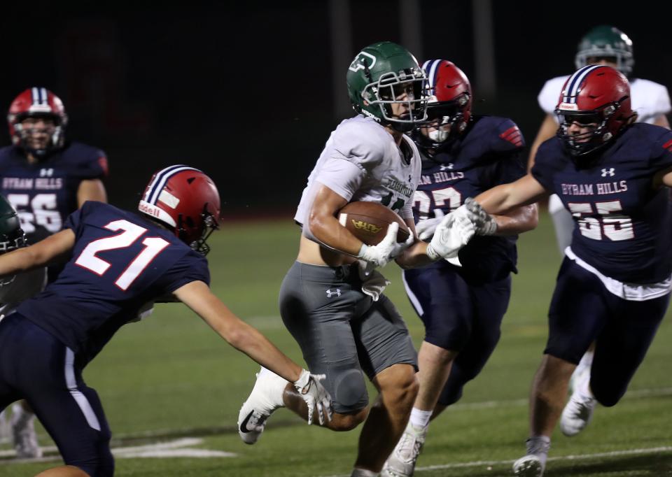 PleasantvilleÕs Daniel Picart (10) looks for some running room in the Byram Hills defense during football action at Fox Lane High School in Bedford Sept. 9, 2023. Picard scored five touchdowns in the Panthers 42-10 victory.