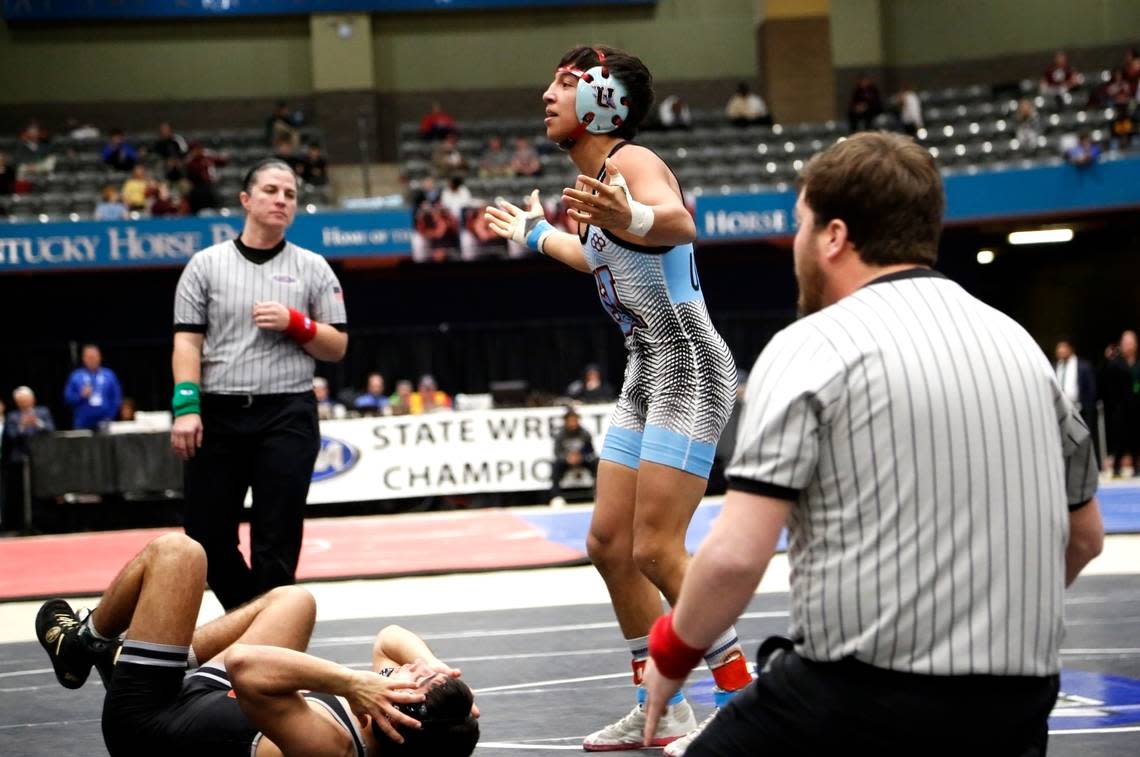 Union County’s Jordyn Raney played to his school’s cheering section after defeating Taylor County’s Leland Reeves in the 132-pound division at the boys/co-ed KHSAA State Wrestling Championships at the Kentucky Horse Park’s Alltech Arena on Friday.