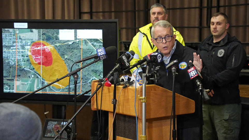 FILE - Ohio Gov. Mike DeWine meets with reporters after touring the Norfolk Southern train derailment site in East Palestine, Ohio, on Feb. 6, 2023. Transportation Secretary Pete Buttigieg announced a package of reforms to improve safety Tuesday, Feb. 21 — two days after he warned the railroad responsible for the derailment, Norfolk Southern, to fulfill its promises to clean up the mess just outside East Palestine, and help the town recover. (AP Photo/Gene J. Puskar, File)