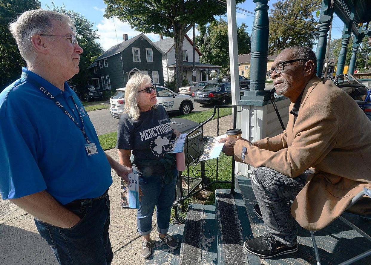 In this file photo, Erie Mayor Joe Schember, left, and Erie City Councilwoman Kathleen Schaaf talk with Byron Eanes at his home in the 400 block of East Seventh Street on Sept. 14, 2019. Schaaf and Schember were greeting local residents as part of a Strengthening Police and Community Partnerships Council project.