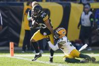 Pittsburgh Steelers' Jaylen Warren runs for a touchdown during the first half of an NFL football game against the Green Bay Packers Sunday, Nov. 12, 2023, in Pittsburgh. (AP Photo/Matt Freed)