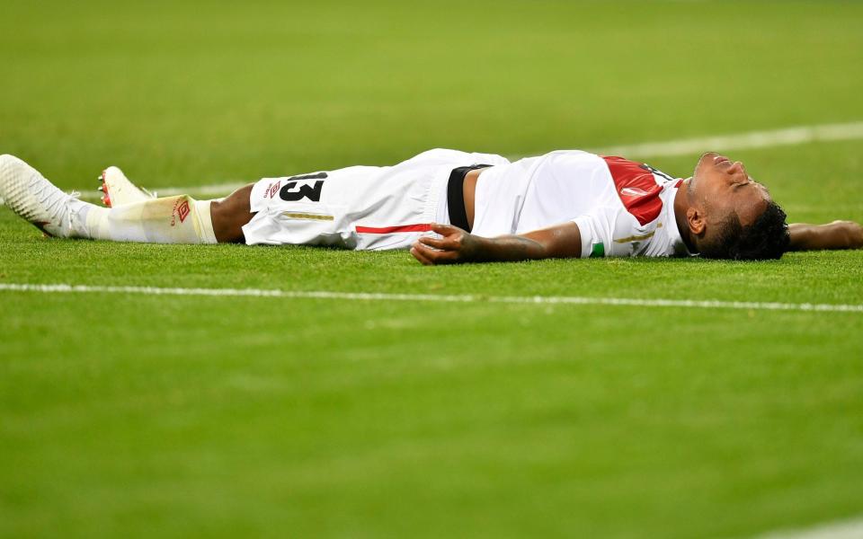 Renato Tapia lies flat out during Peru's game against Denmark on Saturday - AP