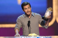 Jake Gyllenhaal accepts the award for Best Kiss at the 2006 MTV Movie Awards (he won for locking lips with the late Heath Ledger in “Brokeback Mountain”).