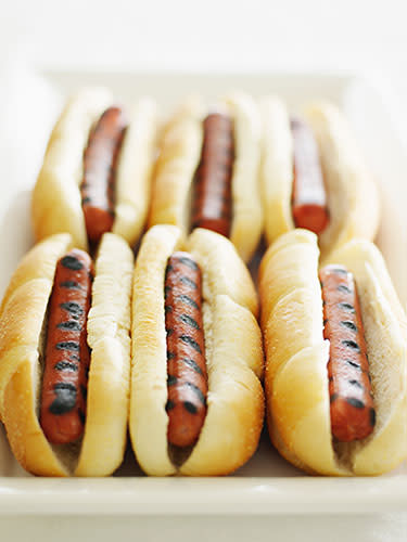 <div class="caption-credit">Photo Credit: Getty Images</div><div class="caption-title">Hot Dogs</div>Since they're filled with sodium, they zap water from kids' bodies-and up children's chances of dehydrating. Plus, those wieners are stocked with saturated fat, which is a factor in causing heart disease, even in tiny tickers. Another reason to ditch dogs: One study found that <a href="http://missclasses.com/mp3s/Prize%20CD%202010/Previous%20years/hot%20dogs/leukemia.pdf" rel="nofollow noopener" target="_blank" data-ylk="slk:children who eat more than 12 hot dogs per month are significantly more likely to develop childhood leukemia" class="link ">children who eat more than 12 hot dogs per month are significantly more likely to develop childhood leukemia</a> than their weiner-eschewing counterparts. <br> <p> <b>Smart swap:</b> Chicken apple sausages, suggests Crandall. They're made with lean meat that's lower in fat, calories and salt. The sausages also contain bits of real (and really nutritious) apple, which add a touch of sweetness that most kids love. <br>  </p><p>Also on Woman's Day:</p> <b><a href="http://www.womansday.com/health-fitness/diet-weight-loss/20-ways-to-burn-more-fat-1654?link=rel&dom=yah_life&src=syn&con=blog_wd&mag=wdy" rel="nofollow noopener" target="_blank" data-ylk="slk:20 Ways To Burn More Fat" class="link ">20 Ways To Burn More Fat</a><br><b><a href="http://www.womansday.com/health-fitness/conditions-diseases/bad-habits-that-are-good-for-you?link=rel&dom=yah_life&src=syn&con=blog_wd&mag=wdy" rel="nofollow noopener" target="_blank" data-ylk="slk:9 Bad Habits That Are Good For You" class="link ">9 Bad Habits That Are Good For You</a></b></b>