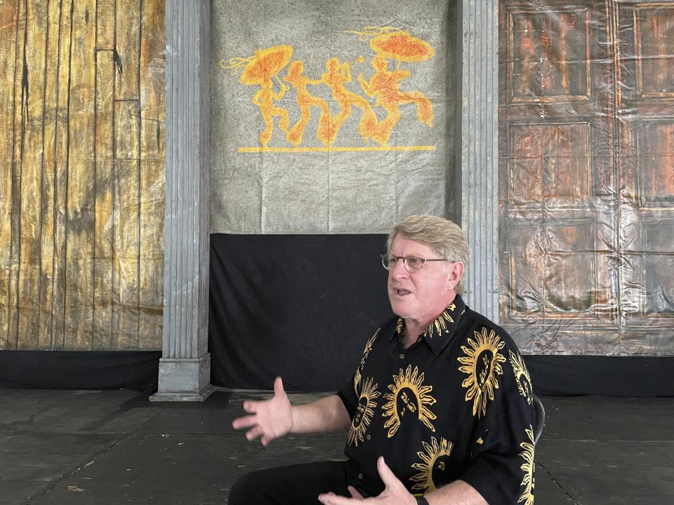 Quint Davis, the producer of the New Orleans Jazz & Heritage Festival, discusses the festival’s return as he sits on the stage in the festival’s Blues Tent on Tuesday, April 26, 2022. The festival opens Friday for the first time in three years after cancellations in 2020 and 2021 due to the COVID-19 pandemic. (AP Photo /Kevin McGill)