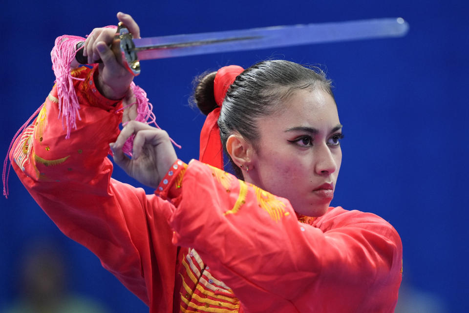 Brunei's Lachkar Basma performs during women's taijijian wushu at the 19th Asian Games in Hangzhou, China, Sunday, Sept. 24, 2023. (AP Photo/Vincent Thian)