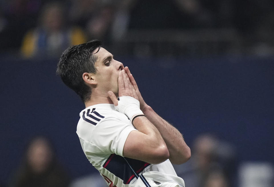 Vancouver Whitecaps' Brian White reacts after the bail went out of play when he blocked a pass by Los Angeles FC goalkeeper Maxime Crepeau during the first half in Game 2 of a first-round MLS playoff soccer match in Vancouver, British Columbia, Sunday, Nov. 5, 2023. (Darryl Dyck/The Canadian Press via AP)