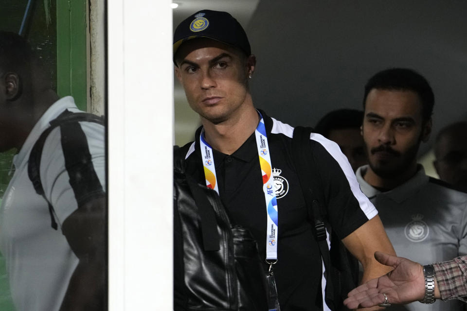 FILE - Saudi Arabian Al Nassr player Cristiano Ronaldo arrives at the Azadi Stadium prior to his team's match against Iran's Persepolis during AFC Champions League, in Tehran, Iran, Tuesday, Sept. 19, 2023. On Friday, Oct. 20, The Associated Press reported on stories circulating online incorrectly claiming Ronaldo was sentenced to 99 lashes in Iran for hugging a woman. (AP Photo/Vahid Salemi, File)