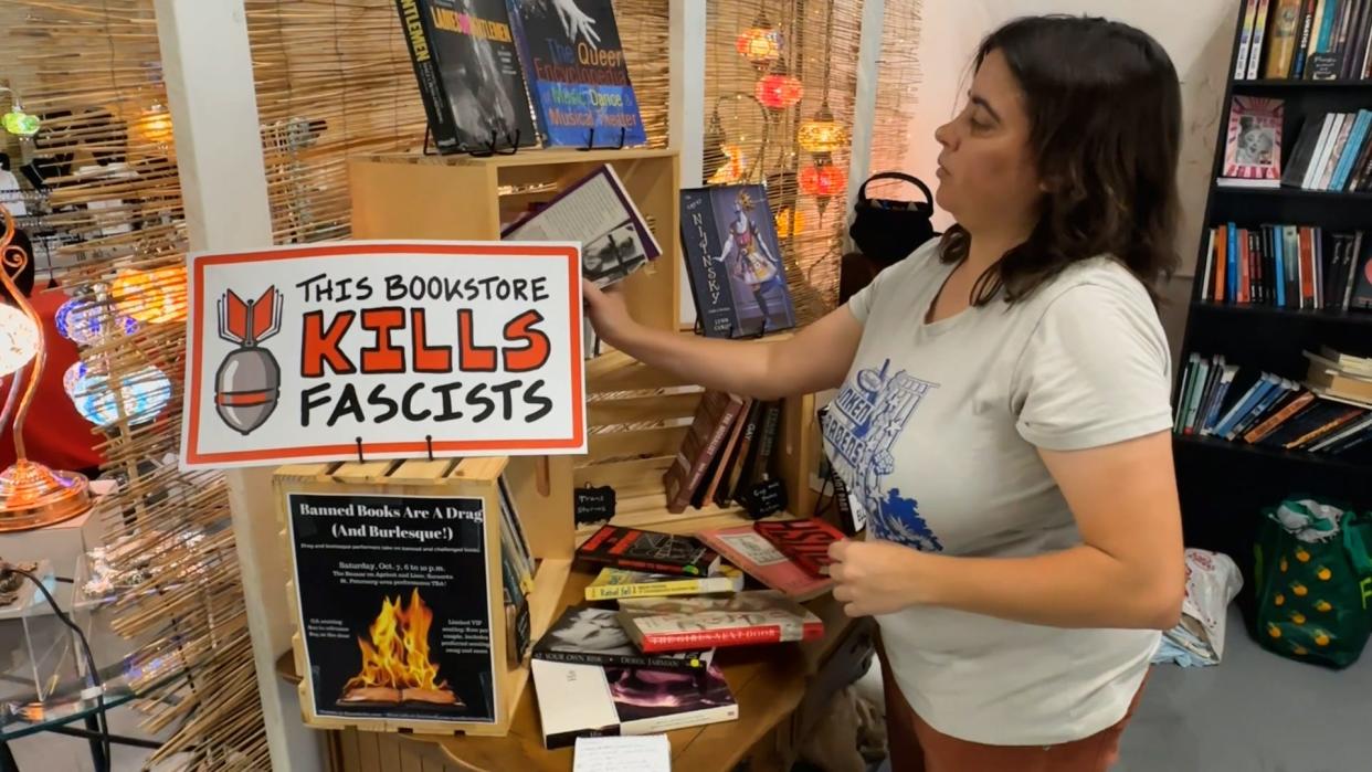 Tiffany Razzano's kiosk inside The Bazaar at Apricot & Lime in Sarasota specializes in selling books that have been banned by communities or school districts. The choice of titles, Razzano says, includes "Anything that they don't want you to read in school."