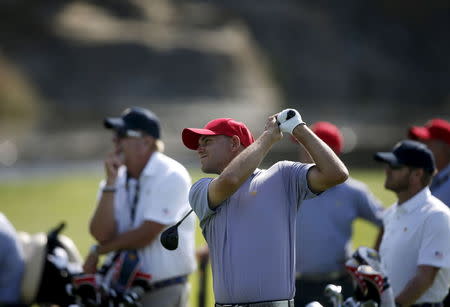 U.S. team member Bill Haas watches his shot after hitting the second shot during the 2015 Presidents Cup golf tournament at The Jack Nicklaus Golf Club in Incheon, South Korea, October 6, 2015. REUTERS/Kim Hong-Ji