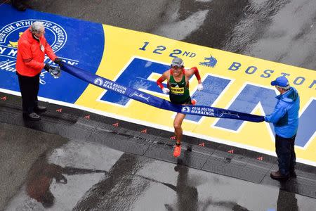 Apr 16, 2018; Boston, MA, USA; Yuki Kawauchi crosses the finish line of the 2018 Boston Marathon winning the men's division. Mandatory Credit: Brian Fluharty-USA TODAY Sports