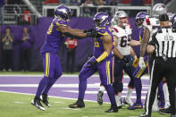 Minnesota Vikings linebacker Danielle Hunter, left, and Minnesota Vikings defensive tackle Ross Blacklock (96) celebrate after a sack during the second half of an NFL football game against the New England Patriots, Thursday, Nov. 24, 2022, in Minneapolis. The Vikings won 33-26. (AP Photo/Bruce Kluckhohn)