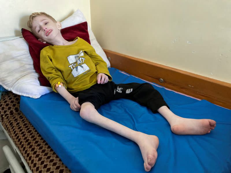 Malnourished Palestinian boy Fadi al-Zant lies on a bed at Kamal Adwan hospital, amid the ongoing conflict between Israel and Hamas, in northern Gaza