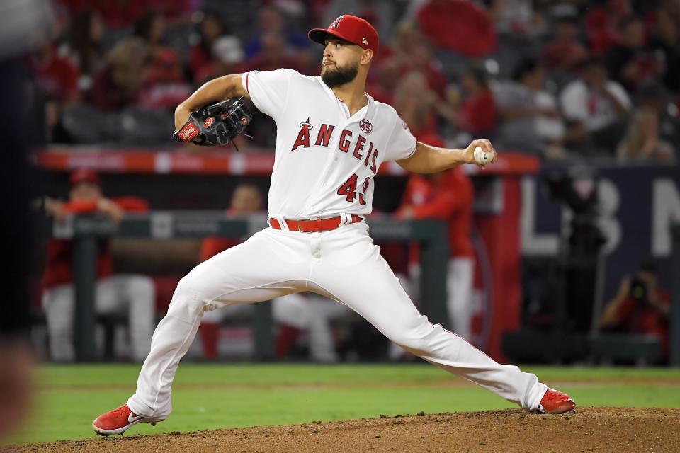 Los Angeles Angels starting pitcher Patrick Sandoval throws to the plate during the second inning of a baseball game against the Houston Astros, Friday, Sept. 27, 2019, in Anaheim, Calif. (AP Photo/Mark J. Terrill)