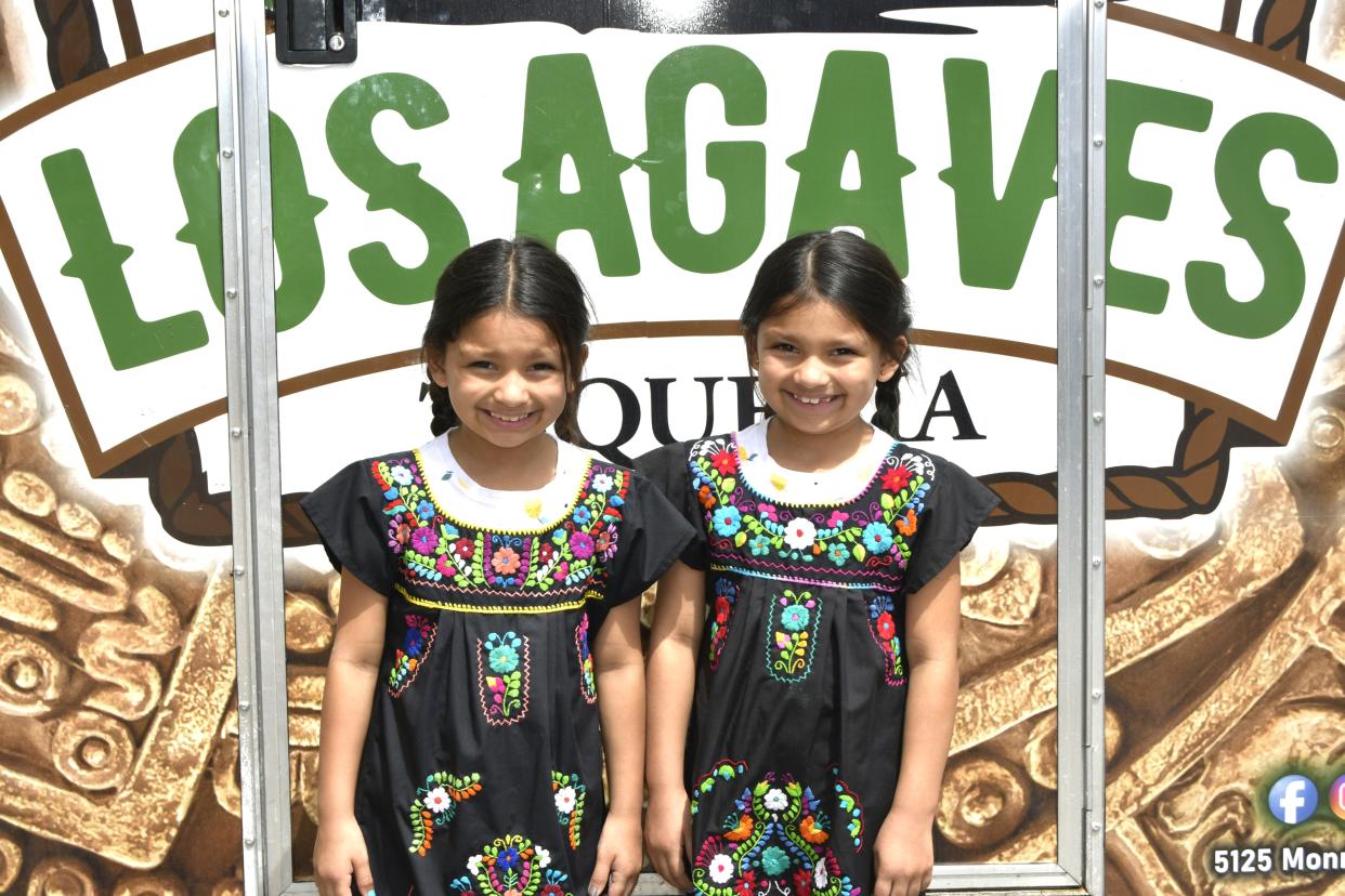 Andi and Amara Moya were wearing their Latino dresses to celebrate their culture at the Cinco de Mayo festival  in Fremont.