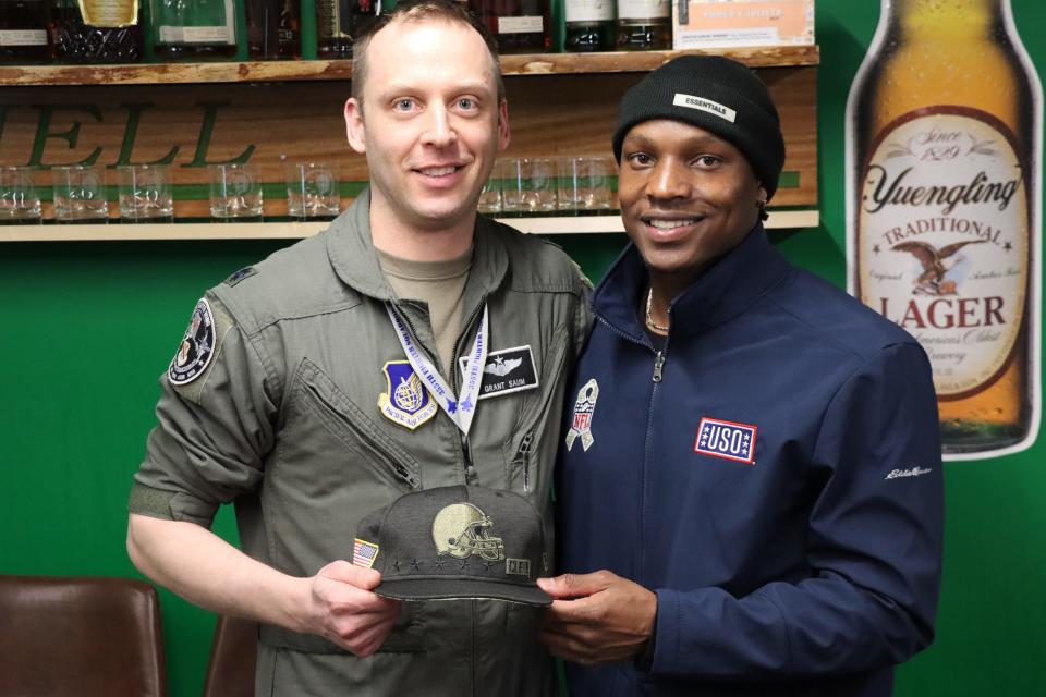 Cleveland Browns running back/receiver Demetric Felton Jr. meets a military member during an NFL-USO trip to Alaska in 2022.