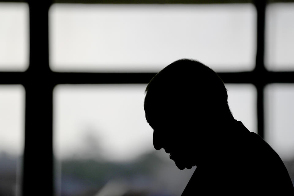 The head of the Portuguese Bishops Conference, Bishop Jose Ornelas, reads a document during a news conference to comment on the report released hours earlier by the Independent Committee for the Study of Child Abuse in the Catholic Church, set up by Portuguese bishops, in Lisbon, Monday, Feb. 13, 2023. The Committee says 512 alleged victims have come forward, but their report warned that the true number is likely higher than 4,800. (AP Photo/Armando Franca)