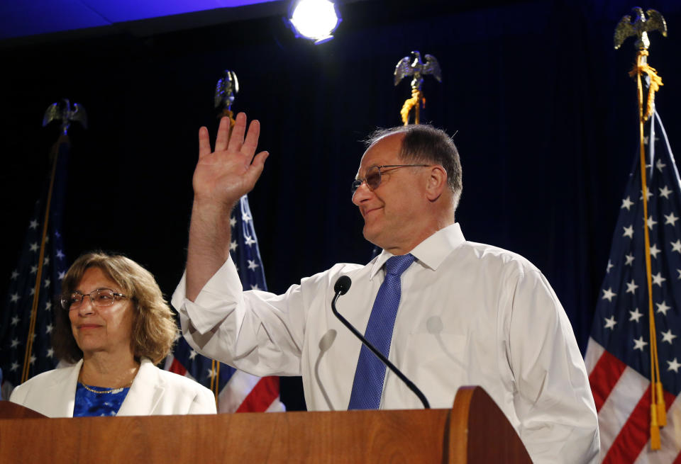 Rep. Michael Capuano, as his wife Barbara listens at left, concedes defeat to Boston City Councilor Ayanna Pressley in the 7th Congressional House Democratic primary, Tuesday, Sept. 4, 2018, at his primary night party in Somerville, Mass. (AP Photo/Elise Amendola)