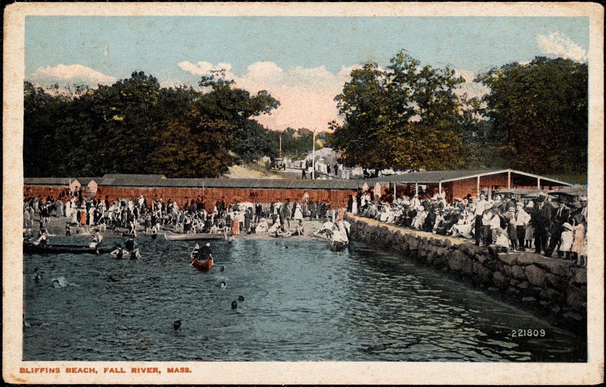 The shore of Bliffins Beach in Fall River is full of bathers and changing stations in this photo postcard. Bliffins Beach no longer exists.
