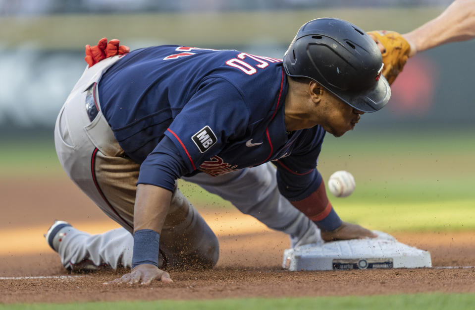 Minnesota Twins' Jorge Polanco steals third base during the third inning of the team's baseball game against the Seattle Mariners, Wednesday, June 16, 2021, in Seattle. (AP Photo/Stephen Brashear)