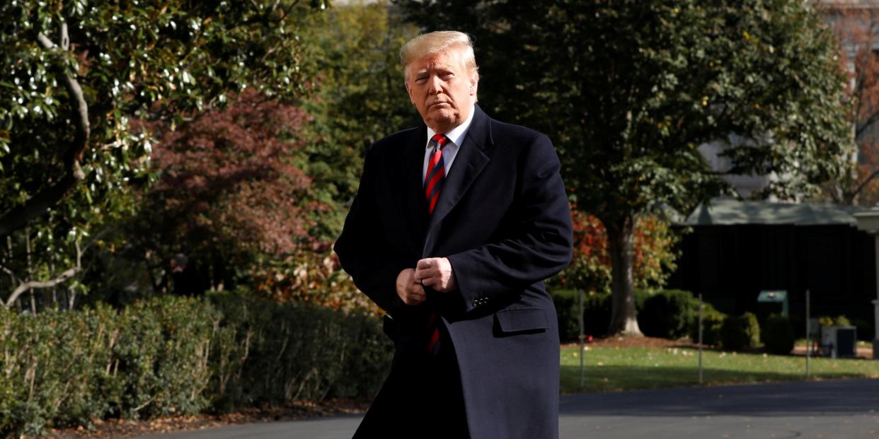 FILE PHOTO: U.S. President Donald Trump looks at the media on the South Lawn of the White House in Washington, U.S., before their departure to Alabama and New York, November 9, 2019. REUTERS/Yuri Gripas