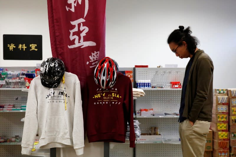 Derek Tai looks at products on a shelf at Chinese University of Hong Kong in Hong Kong