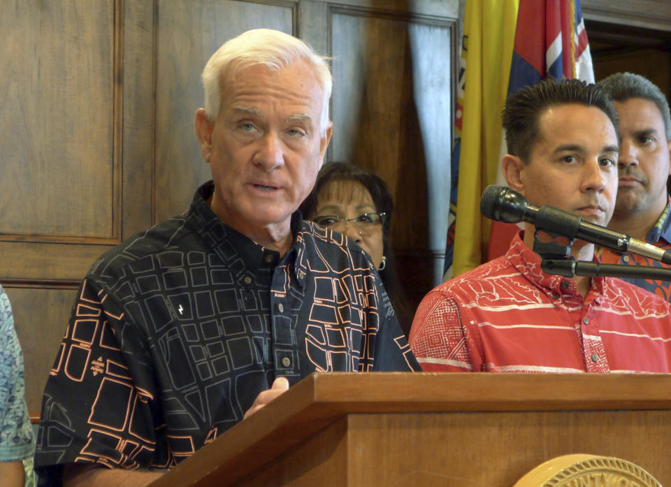 FILE - In this Aug. 28, 2017 file photo, Honolulu Mayor Kirk Caldwell talks to reporters about problems with a rail funding bill in Honolulu. The city of Honolulu's chief legal officer has received a target letter linked to an ongoing federal corruption investigation. Mayor Kirk Caldwell says Corporation Counsel Donna Leong is taking a paid leave of absence, effective Monday, Jan. 14, 2019. (AP Photo/Cathy Bussewitz, File)