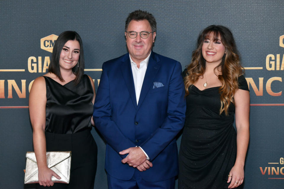Vince Gill brought daughters Jenny Gill Van Valkenburg (left) and Corrina Grant Gill to his CMT honor. (Photo: Jason Davis/Getty Images for CMT)