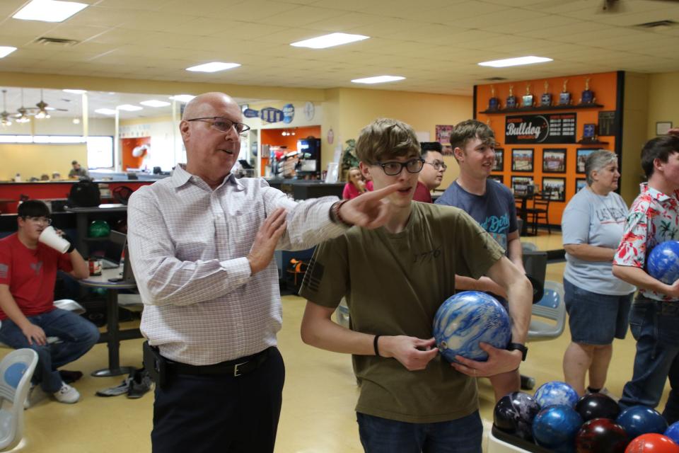 Artesia High School head bowling coach Ken Clayton (left) gives Tyler Romine directions during a practice session on Jan. 29, 2024 at Artesia Lanes.