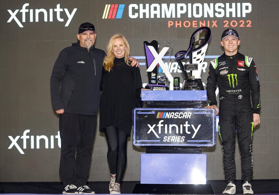 Coy Gibbs (left), wife Heather and son Ty after Ty won the 2022 Xfinity Series championship Saturday night at Phoenix.