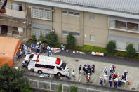 <p>Ambulance crew and police officers are seen outside a facility for the handicapped where a number of people were killed and dozens injured in a knife attack Tuesday, July 26, 2016, in Sagamihara, outside Tokyo. (Kyodo News via AP)</p>