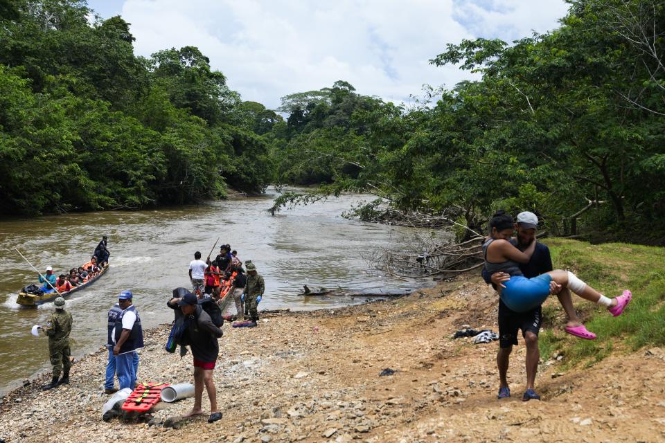 Migrants heading north arrive by boat to Lajas Blancas, Darien province, Panama, Friday, Oct. 6, 2023, after walking across the Darien Gap from Colombia. (AP Photo/Arnulfo Franco)