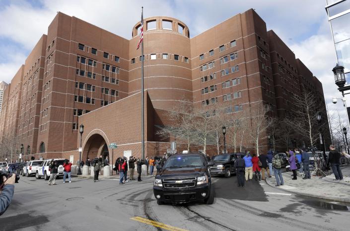 A motorcade carrying Boston Marathon bombing suspect Dzhokhar Tsarnaev rolls away from federal court in Boston Thursday, Dec. 18, 2014, after a final hearing for before his trial begins in January. Tsarnaev is charged with carrying out the April 2013 attack that killed three people and injured more than 260. He could face the death penalty if convicted. (AP Photo/Steven Senne)