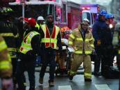 Emergency crews on the scene of a massive construction crane collapse on a street in downtown Manhattan in New York, February 5, 2016. REUTERS/Brendan McDermid