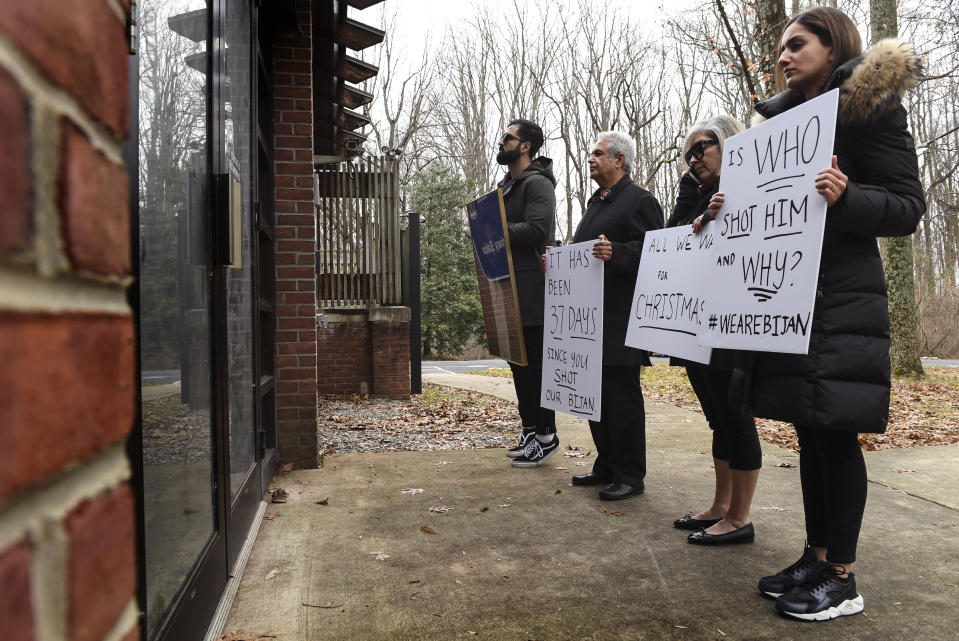 From left, Kouros Emami, the brother-in-law of Bijan Ghaisar; his parents, James and Kelly Ghaisir, and Negeen Ghaisar, his sister, stand in front of the Park Police George Washington Memorial Parkway Station trying to get someone to talk to them on Dec. 24, 2017. (Photo: Toni L. Sandys/The Washington Post via Getty Images)