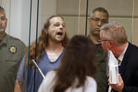 <p>Jeremy Joseph Christian shouts as he is arraigned in Multnomah County Circuit Court in Portland, Ore., Tuesday, May 30, 2017. (Beth Nakamura/The Oregonian via AP, Pool) </p>