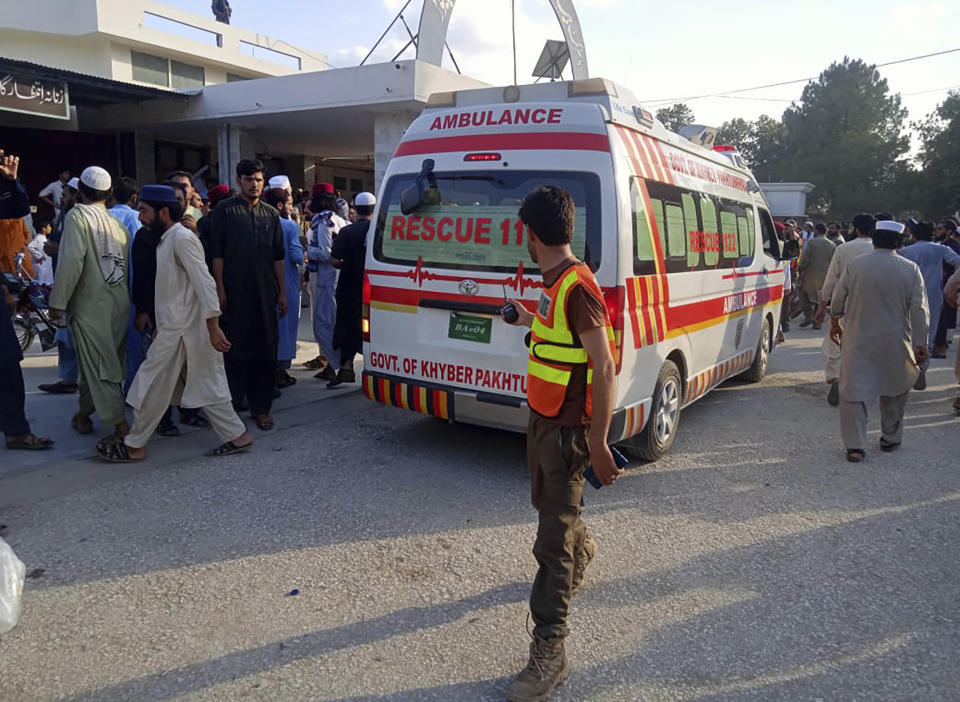 In this photo provided by Rescue 1122 Head Quarters, an ambulance carries injured people after a bomb explosion in the Bajur district of Khyber Pakhtunkhwa, Pakistan, Sunday, July 30, 2023. A powerful bomb ripped through a rally by supporters of a hard-line cleric and political leader in the country’s northwestern Bajur district that borders Afghanistan on Sunday, killing at least 10 people and wounding more, police said. (Rescue 1122 Head Quarters via AP)