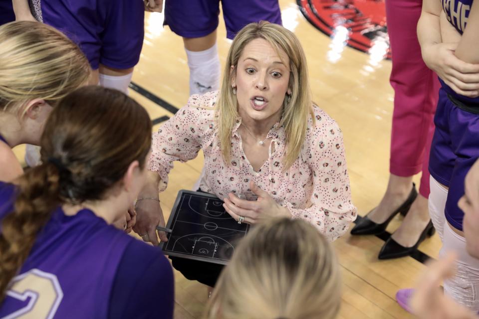 Okarche girls basketball coach Haley Mitchel talks with her team during the Class A state championship game against Cyril on March 1 at State Fair Arena on March 1.